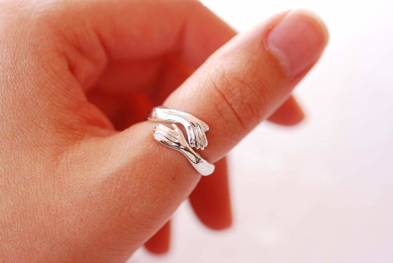 Sterling Silver or Gold Hand Hugging Ring, Embrace Ring, Adjustable Ri –  HarperCrown